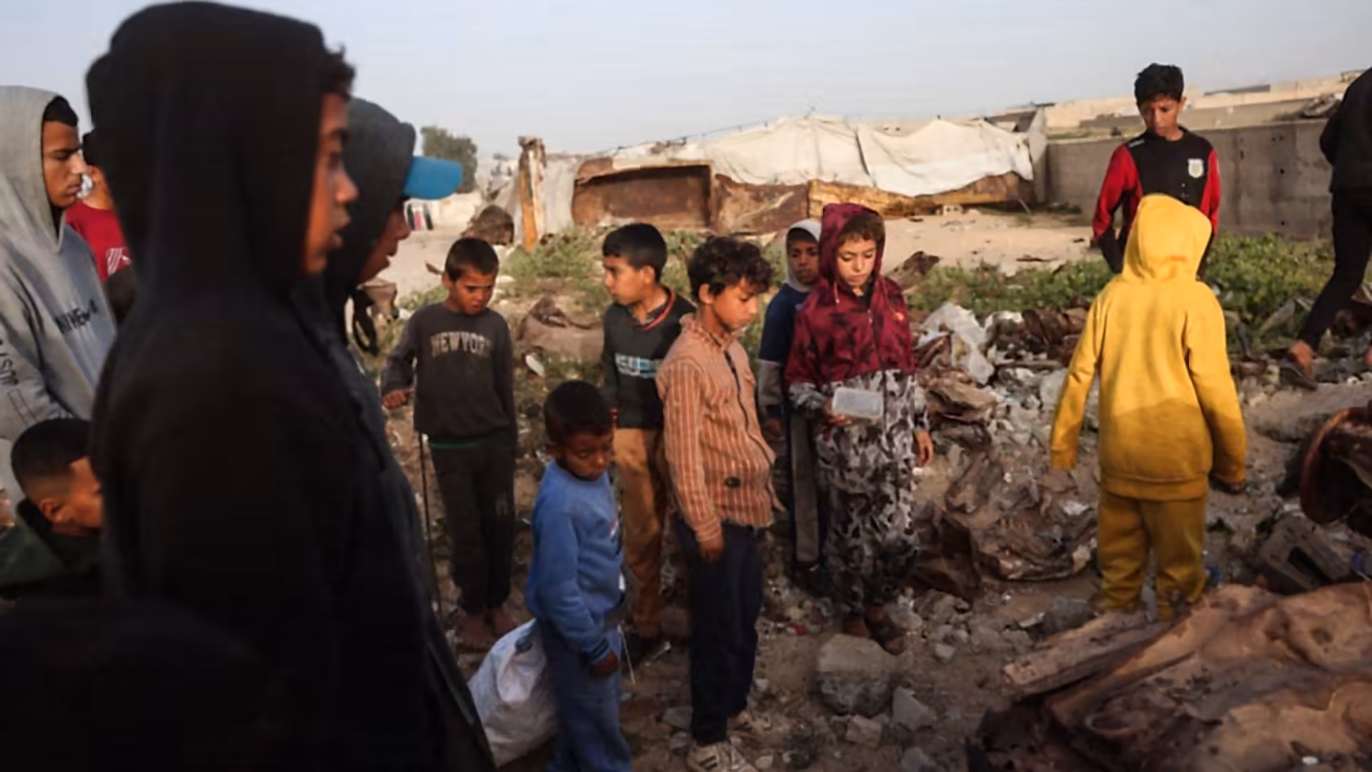 Israeli airstrikes kill at least 12 Palestinians in Gaza as both sides accuse each other of ceasefire violations